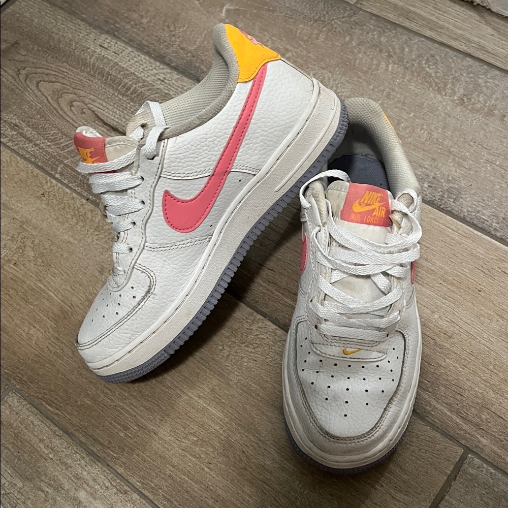 Nike White Sneakers with Pink Swoosh and Yellow Accents